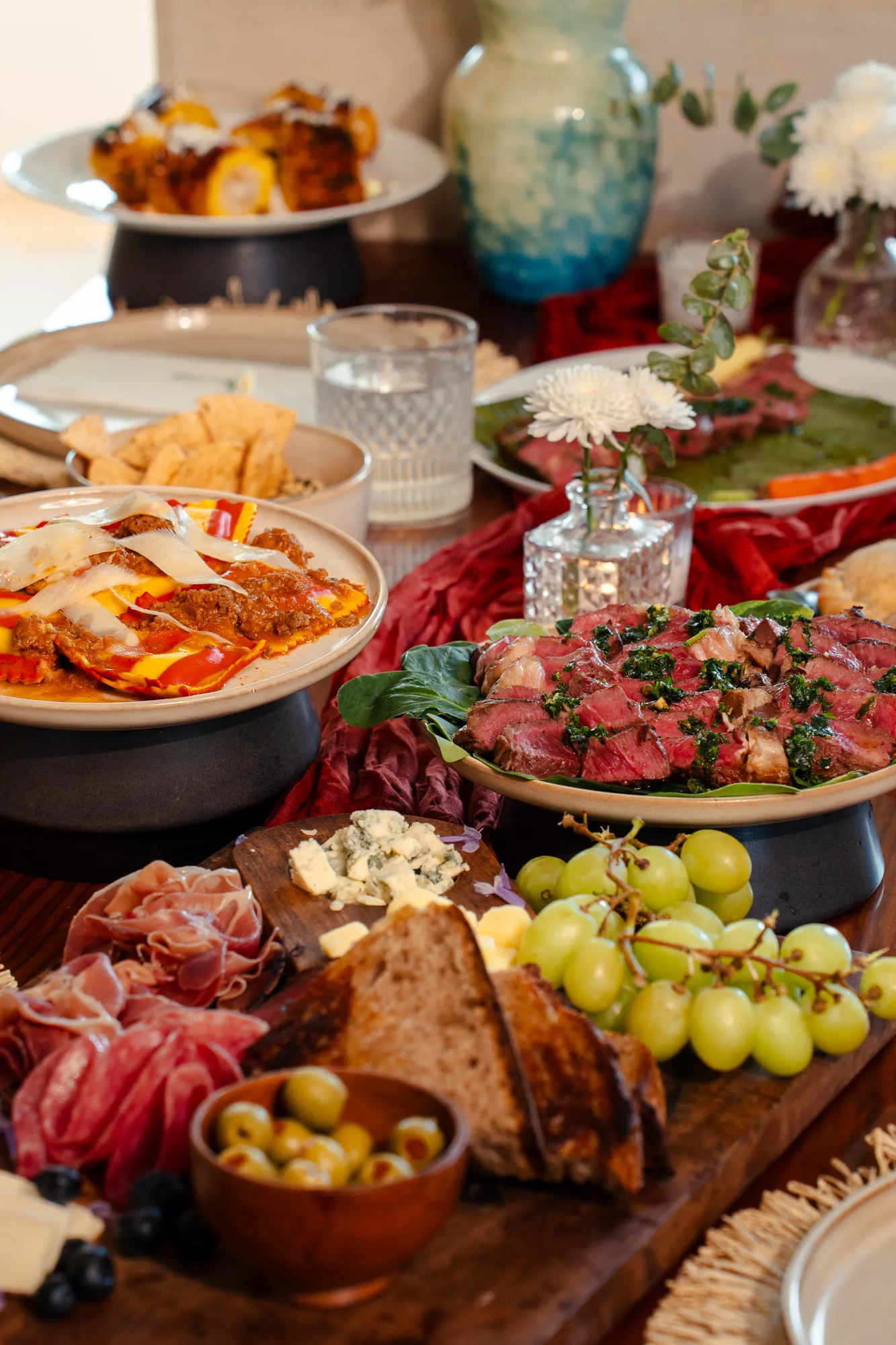Table spread with charcuterie and grilled meats, Habanero's Private Chef Tulum packages